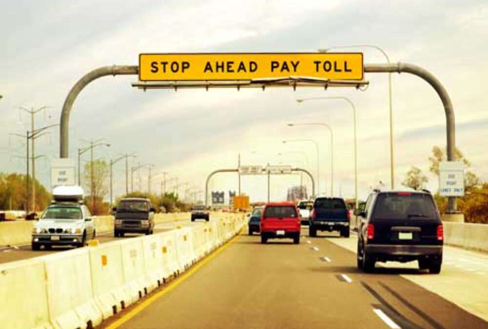 What are the standards for toll signage on highways?
